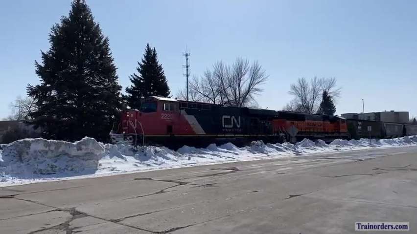 CN-led mixed manifest train rumbling through downtown Grand Forks