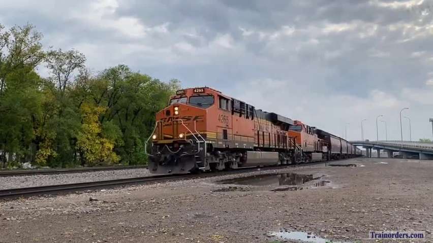 Warren, MN-bound empty grain train past downtown Grand Forks, ND.