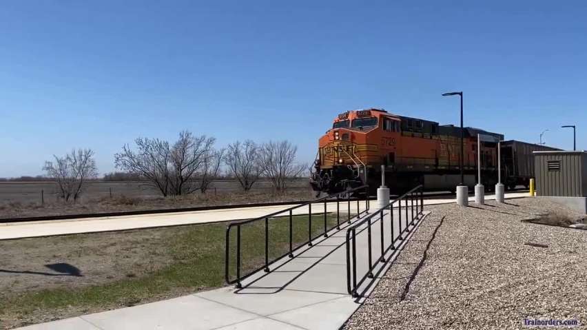 Empty "SUGX" coal train past the Grand Forks, ND, Amtrak station.